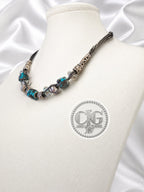 Teal leopard lampwork necklace and bracelet set flat lay on white background