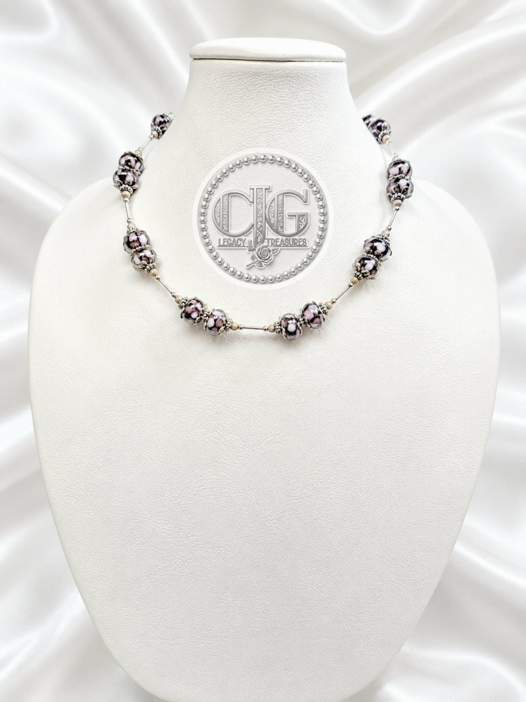 Midnight Bloom glass trollbead necklace displayed on CJG Legacy Treasures branded card