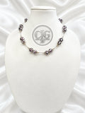 Midnight Bloom glass trollbead necklace displayed on CJG Legacy Treasures branded card