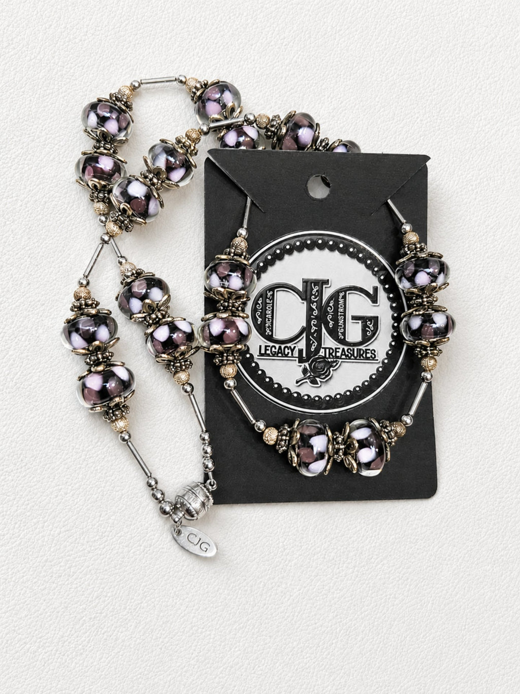 Detail flat lay of necklace beads and silver accents