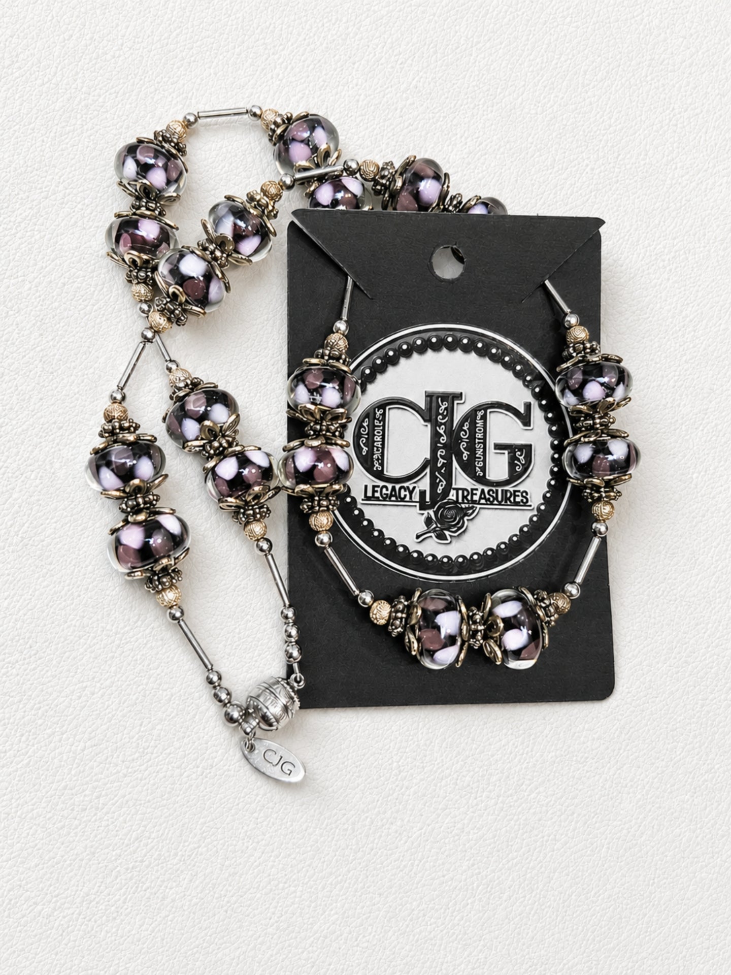Detail flat lay of necklace beads and silver accents