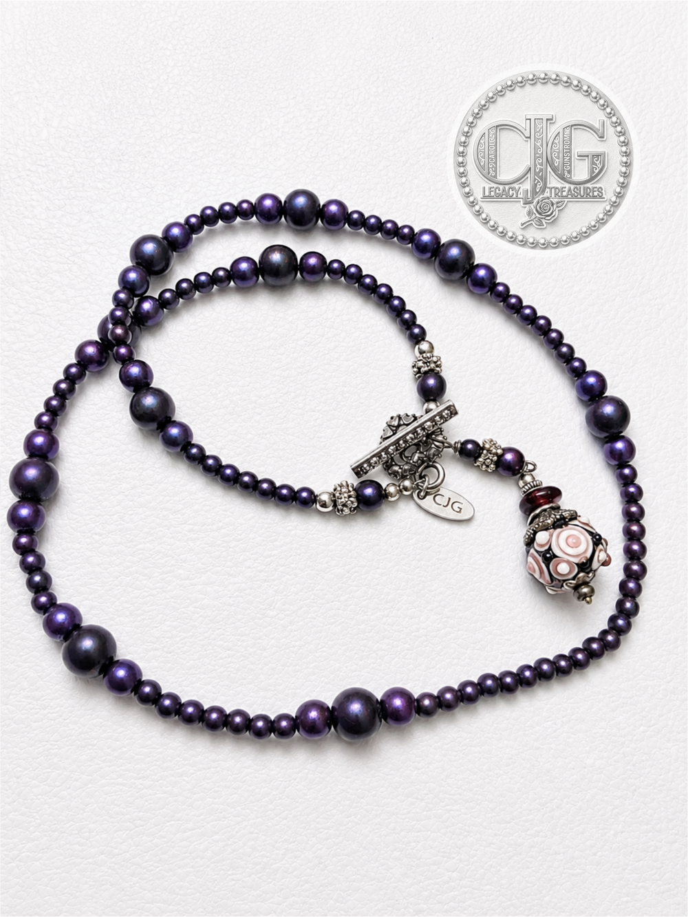 Necklace displayed on CJG Legacy Treasures branded card