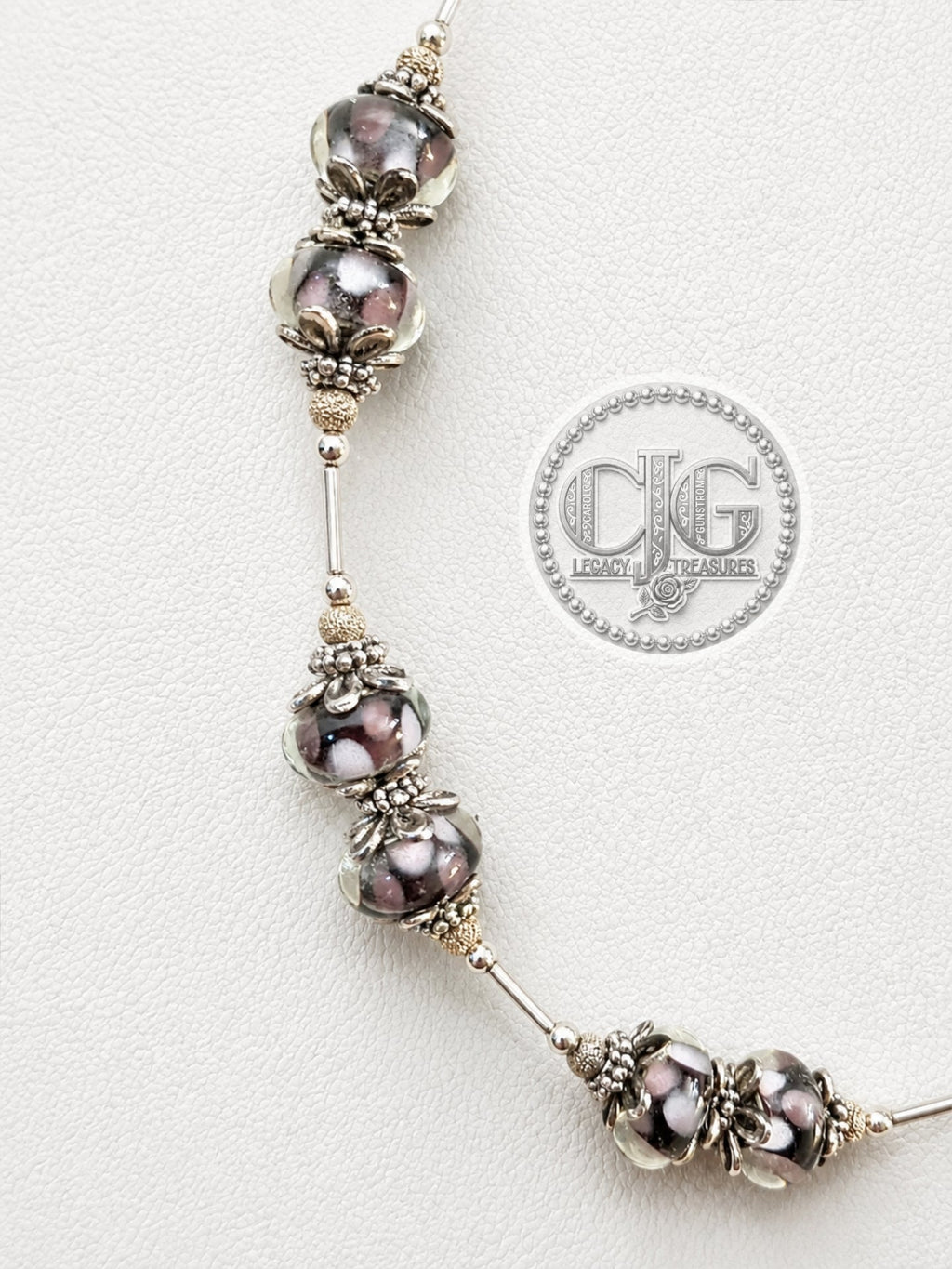 Midnight Bloom necklace on white jewelry bust, angled view showing full drape