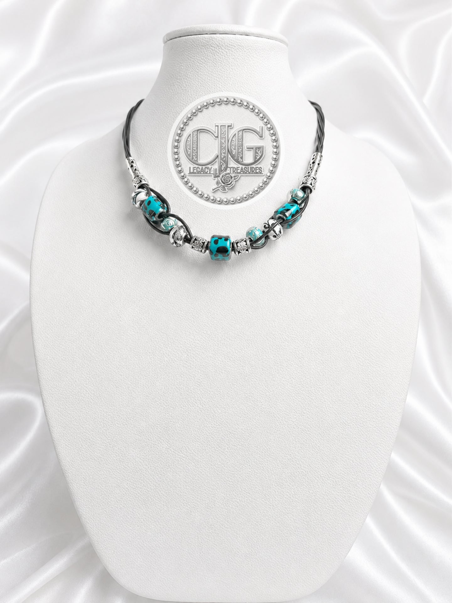 Close-up of woven braid technique on teal leopard lampwork necklace