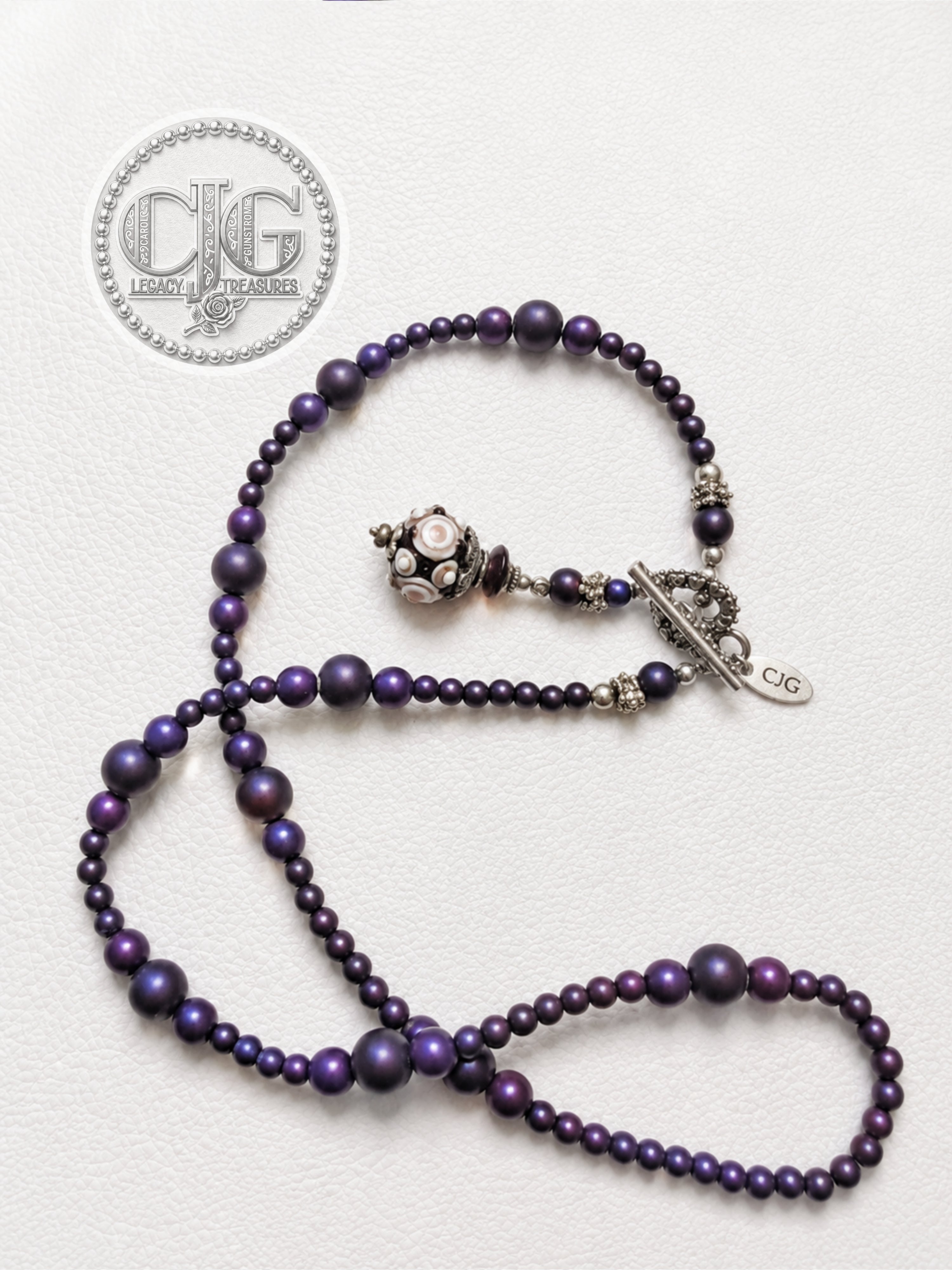 Coiled necklace showing full length and lampwork glass pendant