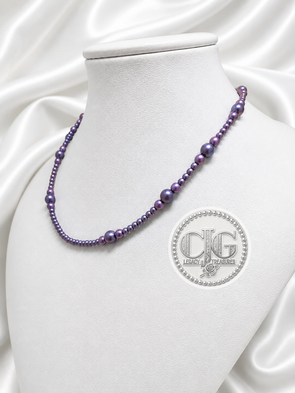 Full view of graduated baroque pearl necklace with lampwork glass bead and toggle clasp
