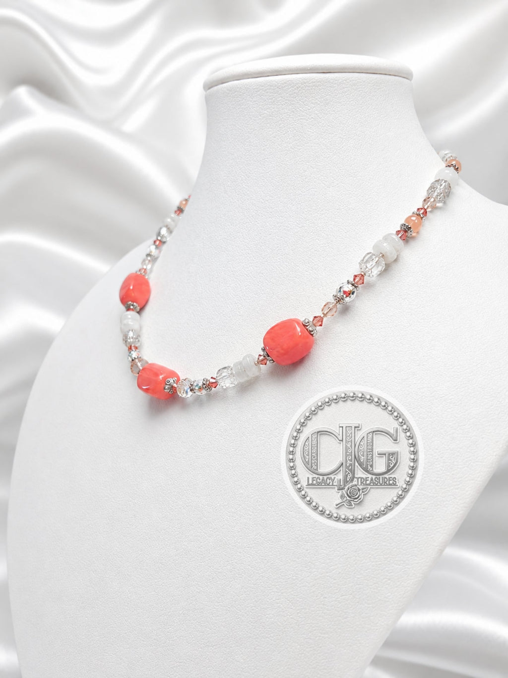 Coral beaded necklace displayed on CJG Legacy Treasures branded black jewelry card